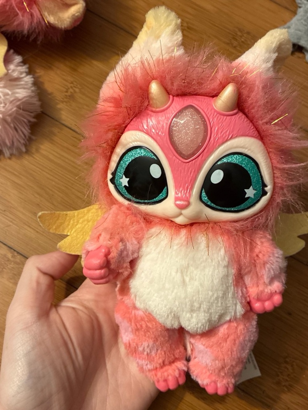 Magic mixies Pink and white plush toy with glittery blue eyes and horns